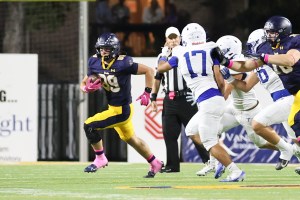 Bear Anderson carries the ball against RL Turner.